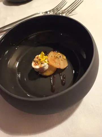 Amuse of goat's cheese, balsamic and pear poached in sake