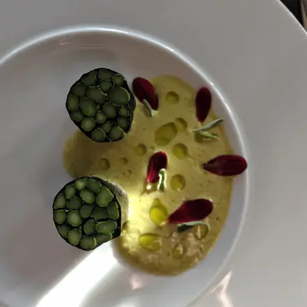 Fine dining starter with a mosaic of green asparagus, sage and lime basil cream